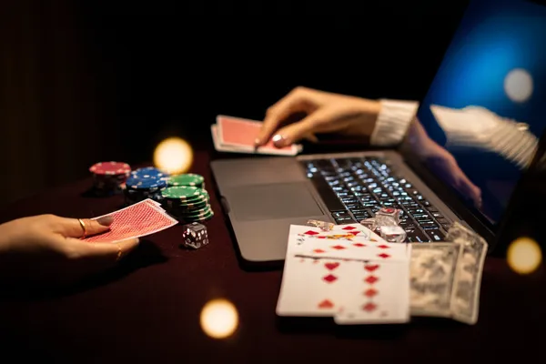 A player using their smartphone during a festive local event, representing 1XBED’s fully mobile-friendly casino.
