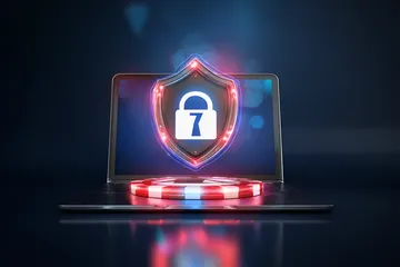 A laptop glowing with a bright login prompt in a minimalistic setup, symbolizing the protected access system at 1XBED.